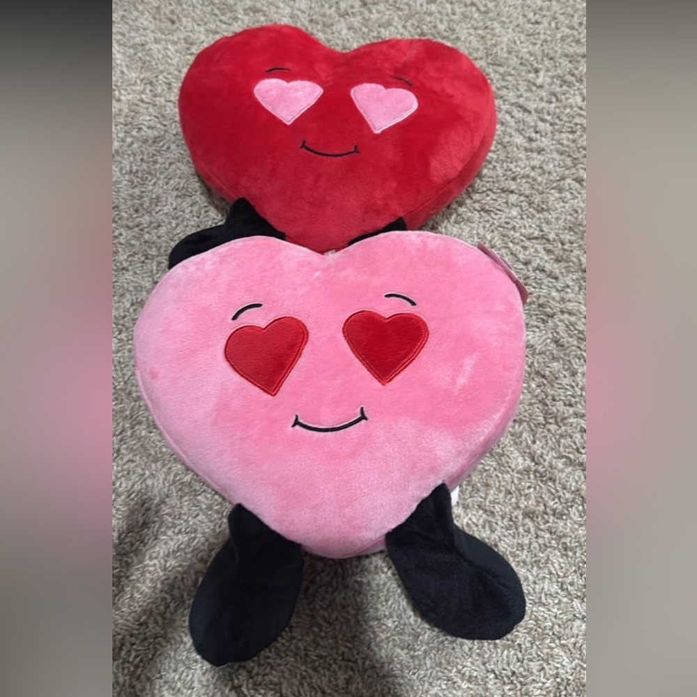 2 heart stuffed animals